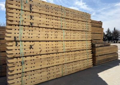 a stack of CCA treated notched shed runners in the lumber yard